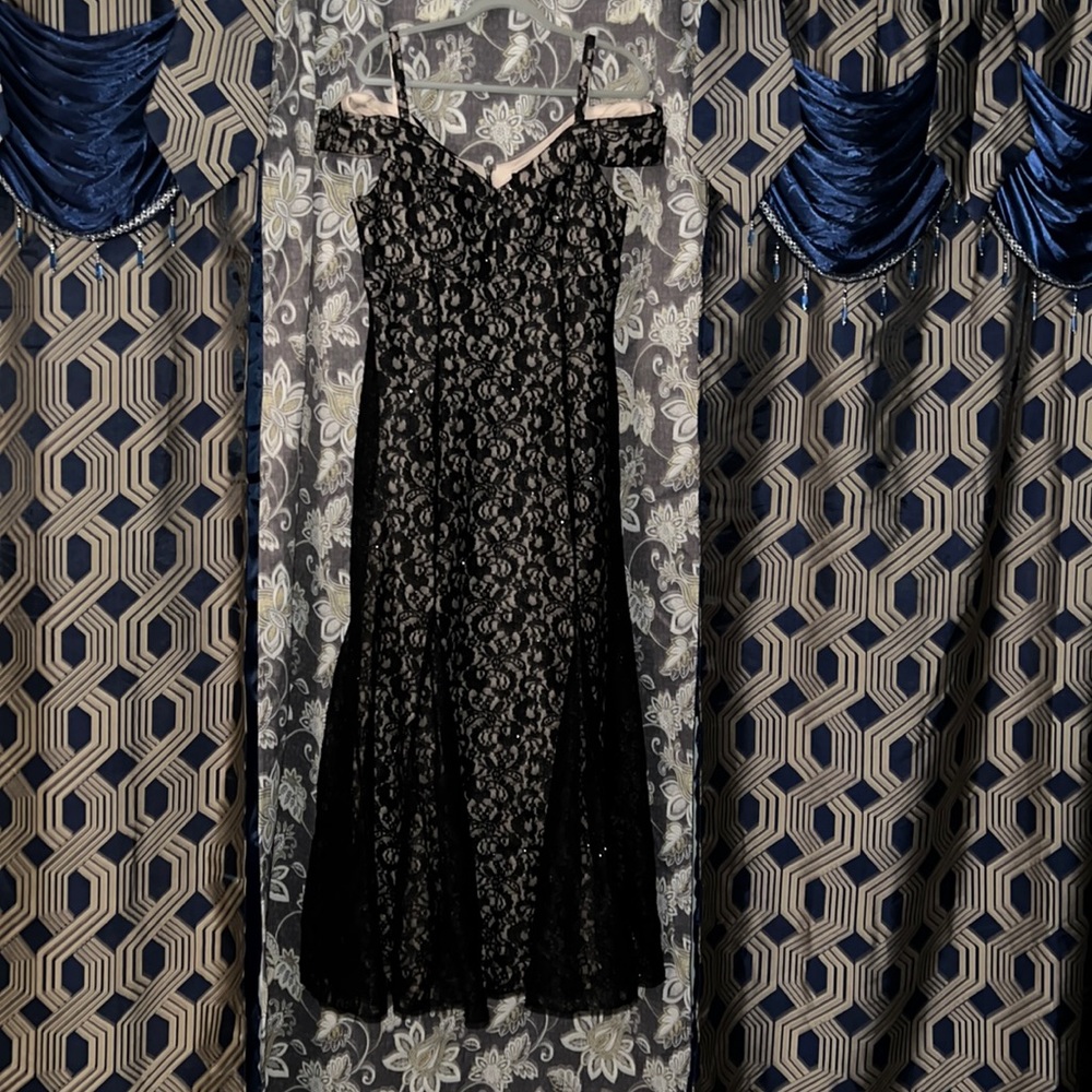 Dress it is size 16, black with a beige background. The brand is R&M Richards